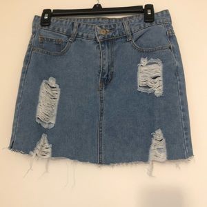 Distressed mini denim skirt
